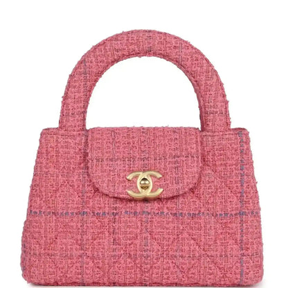 Pink tweed small shopper bag with top handle, front flap, and gold CC clasp