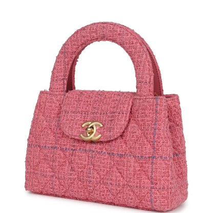 Pink tweed small shopper bag with top handle and gold CC logo on flap