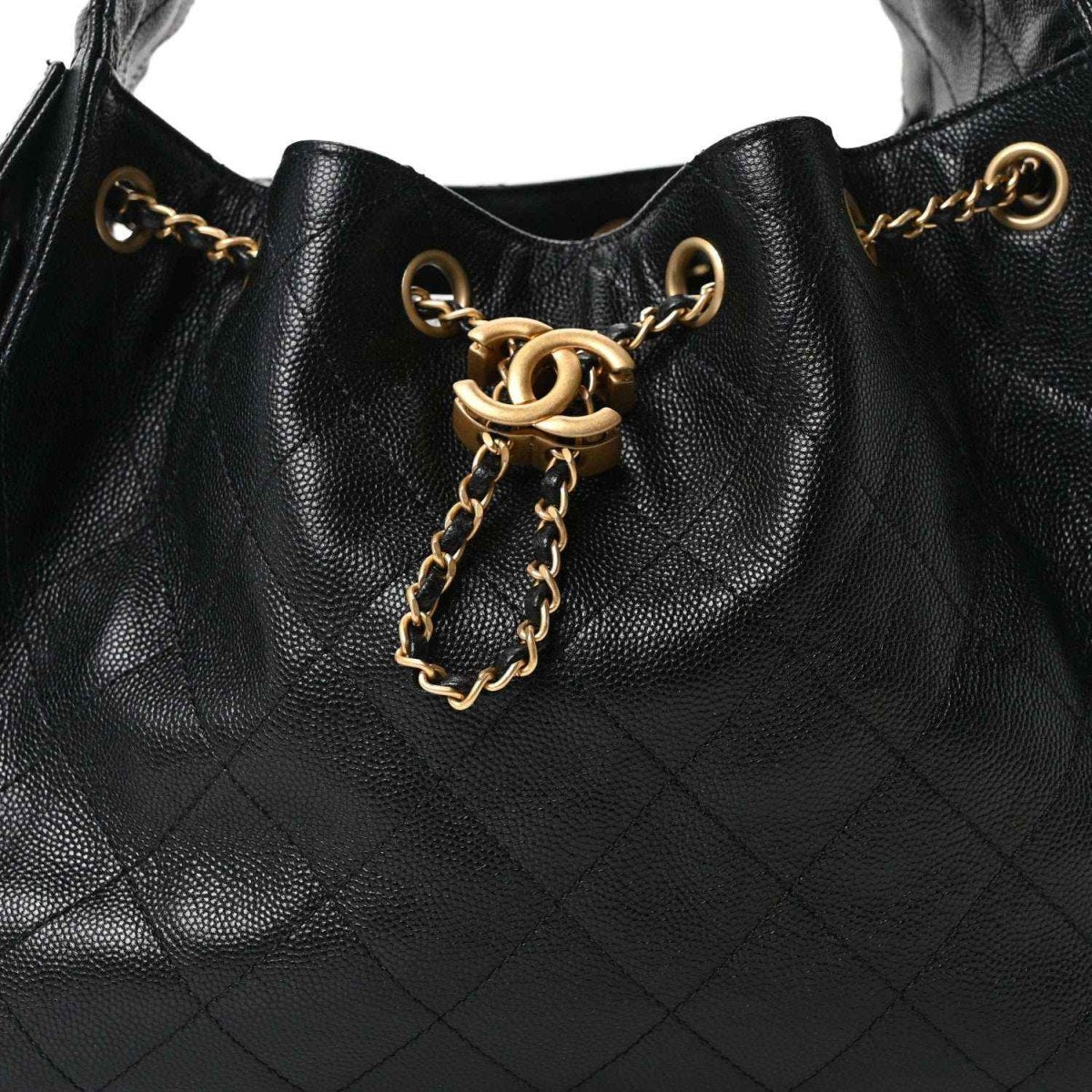 Chanel quilted caviar leather handbag front, black with gold chain tassel