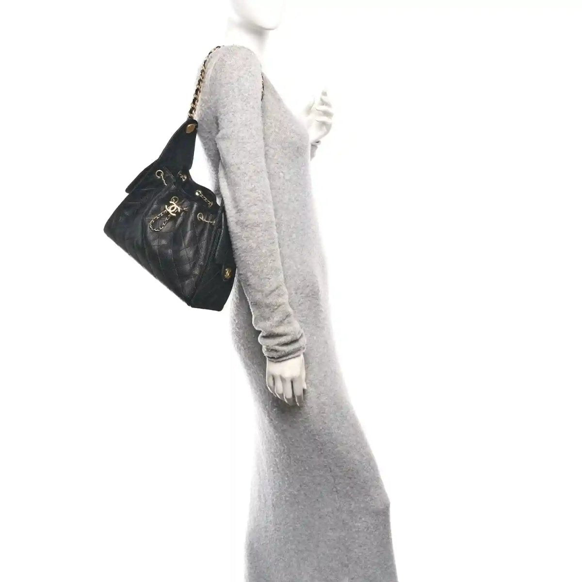 Chanel quilted caviar leather handbag, black, small silhouette with gold chain handle