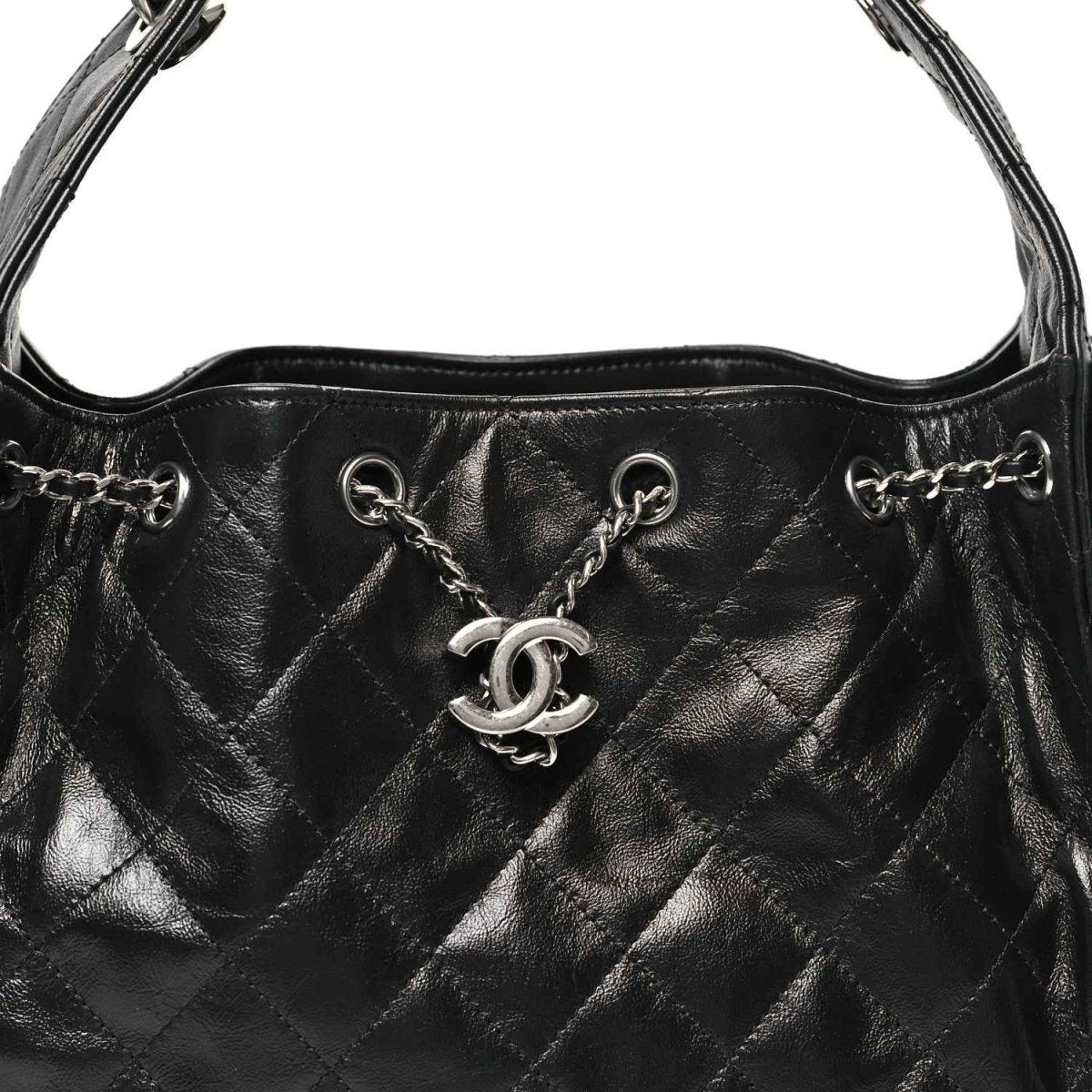 Chanel black quilted leather handbag front with CC emblem and chain links
