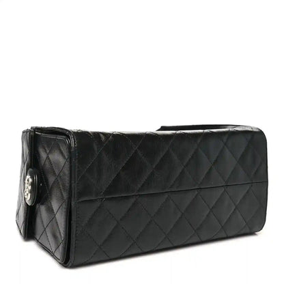 Chanel black quilted leather handbag with front flap and chain strap