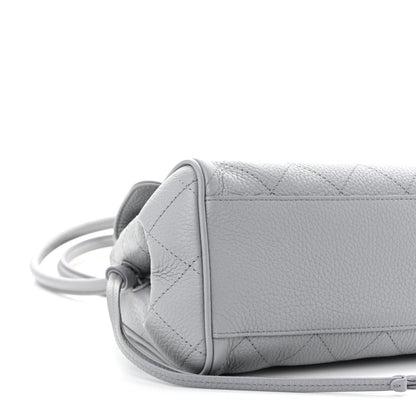CHANEL small shopping bag, grey grained calfskin, side view with attached strap