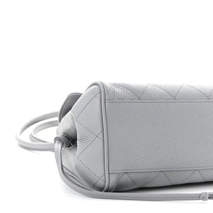 CHANEL small shopping bag, grey grained calfskin, side view with attached strap