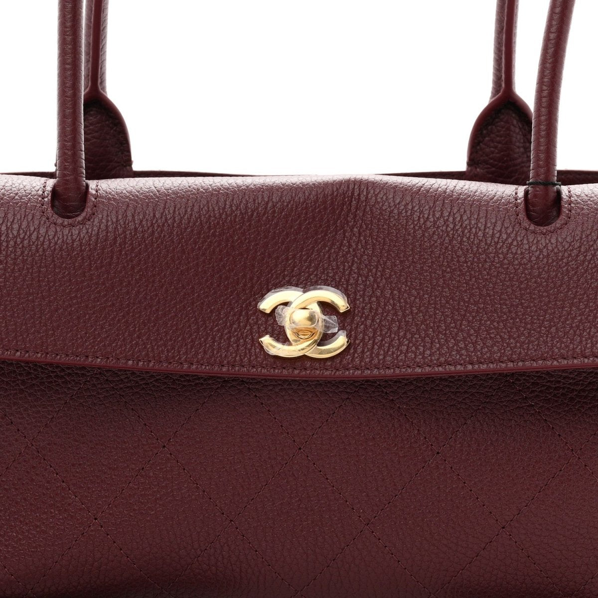 Chanel burgundy grained calfskin bag with gold-tone CC emblem on flap