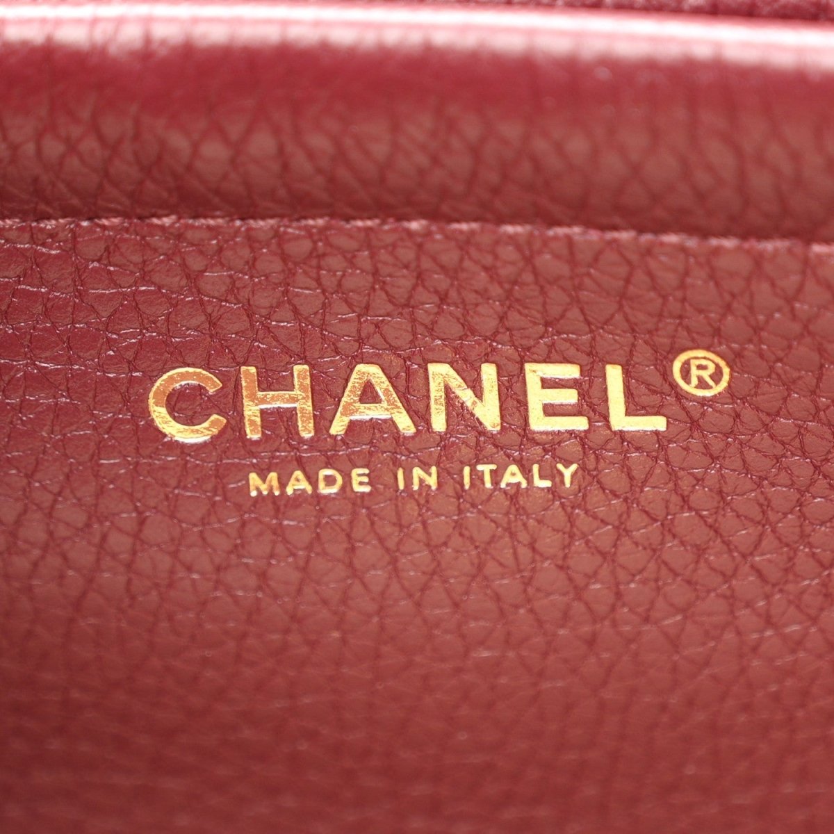 Chanel burgundy grained calfskin with CHANEL and Made in Italy text
