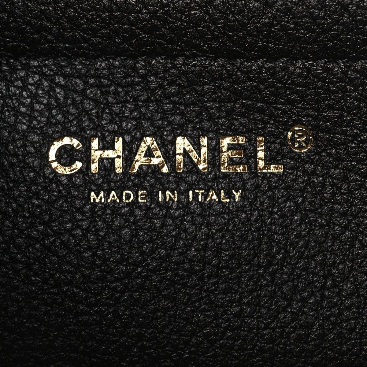 Chanel logo stamp on black leather: MADE IN ITALY