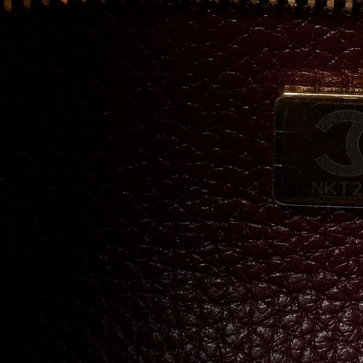 Burgundy leather interior with metal pocket clasp detail