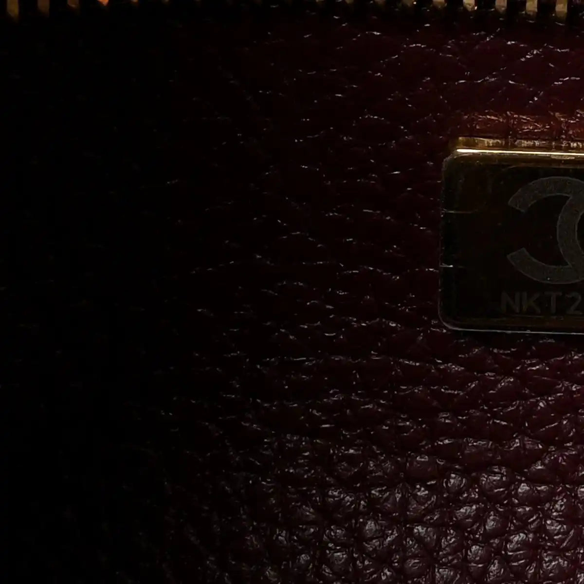 Burgundy leather interior with metal pocket clasp detail