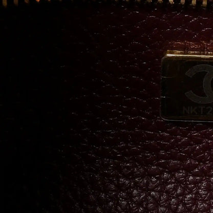 Burgundy leather interior with metal pocket clasp detail