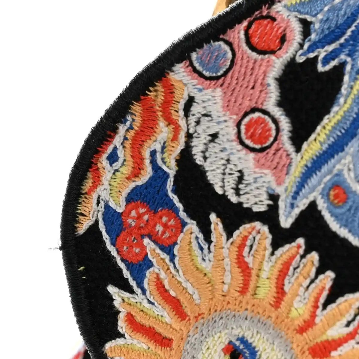 Black canvas embroidered zodiac motif saddle bag detail