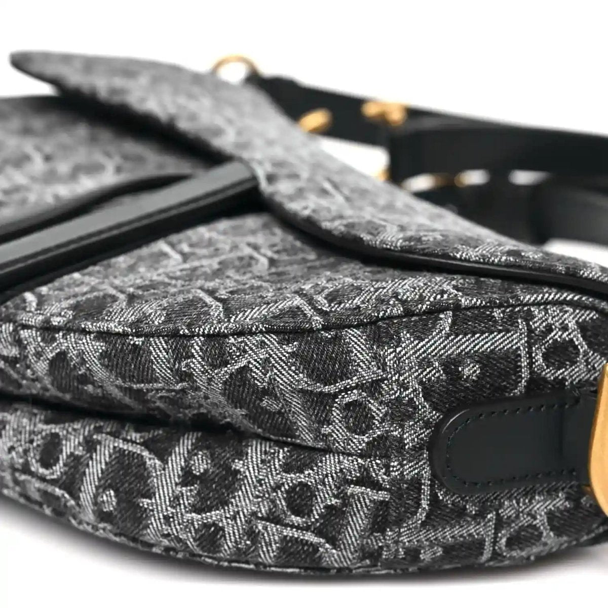 Black jacquard saddle bag with side strap and patterned fabric detail