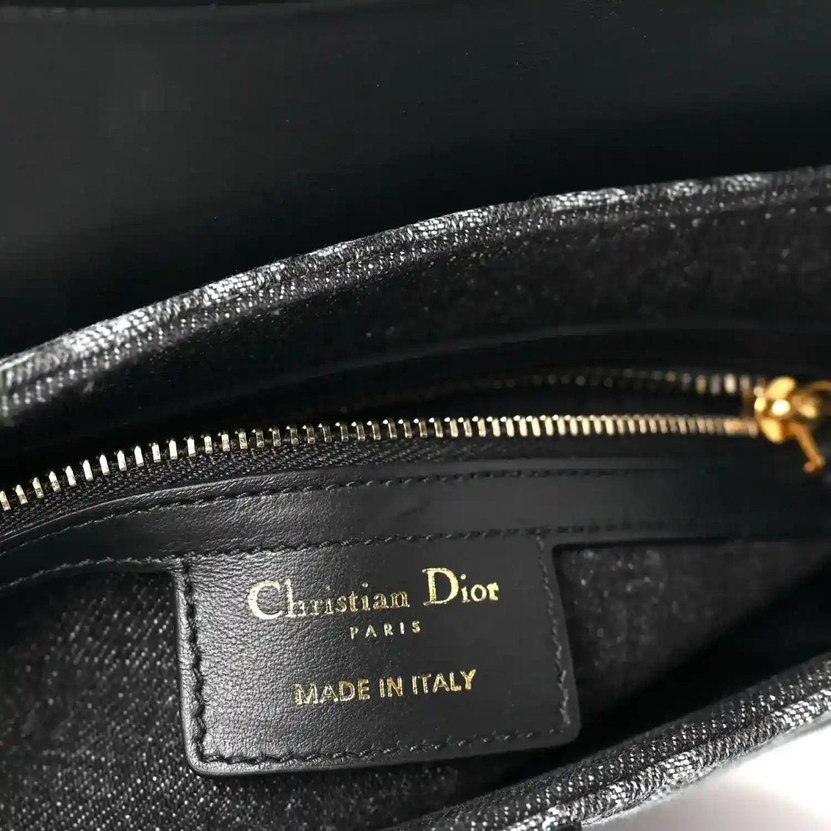 Christian Dior Paris label and Made in Italy text on black interior pocket