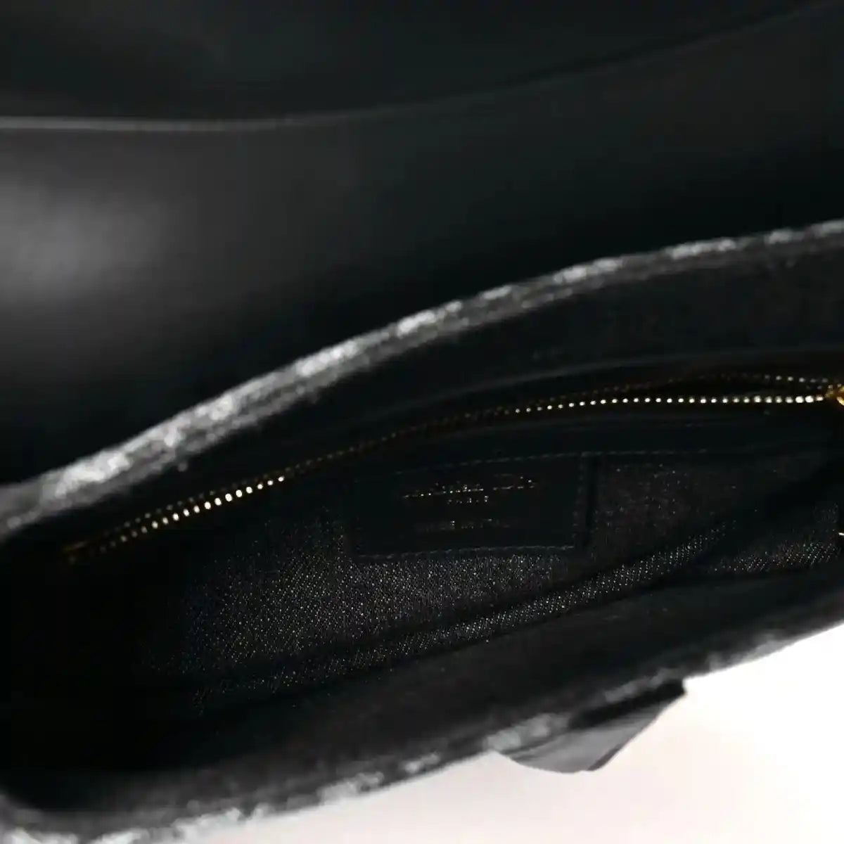 Black interior lining with zip opening inside the saddle bag