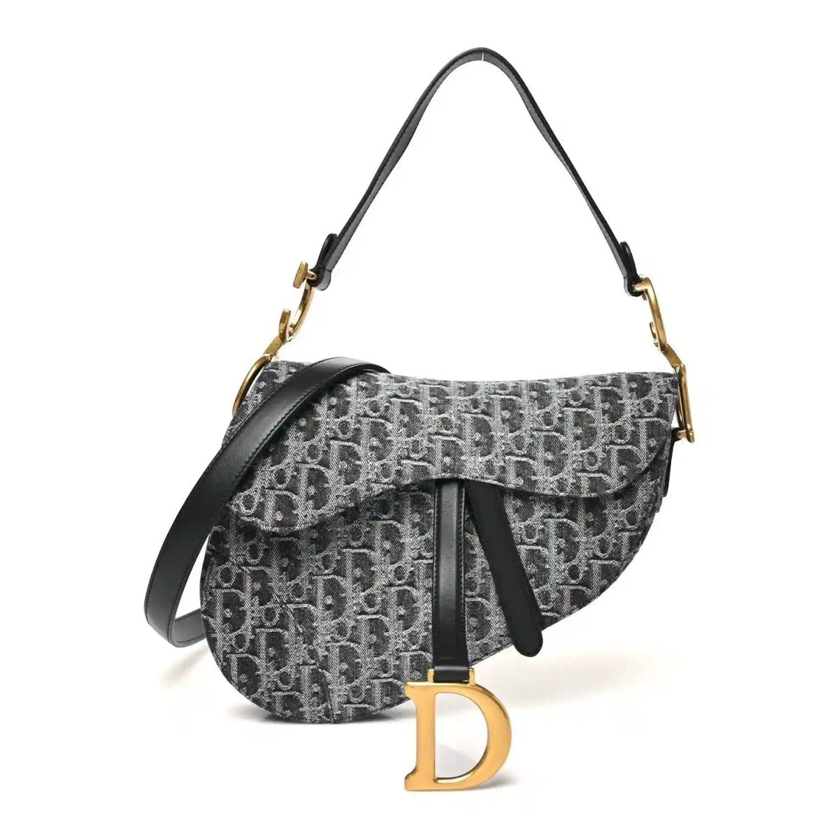 Black jacquard saddle bag with flap, gold-tone hardware, and shoulder strap