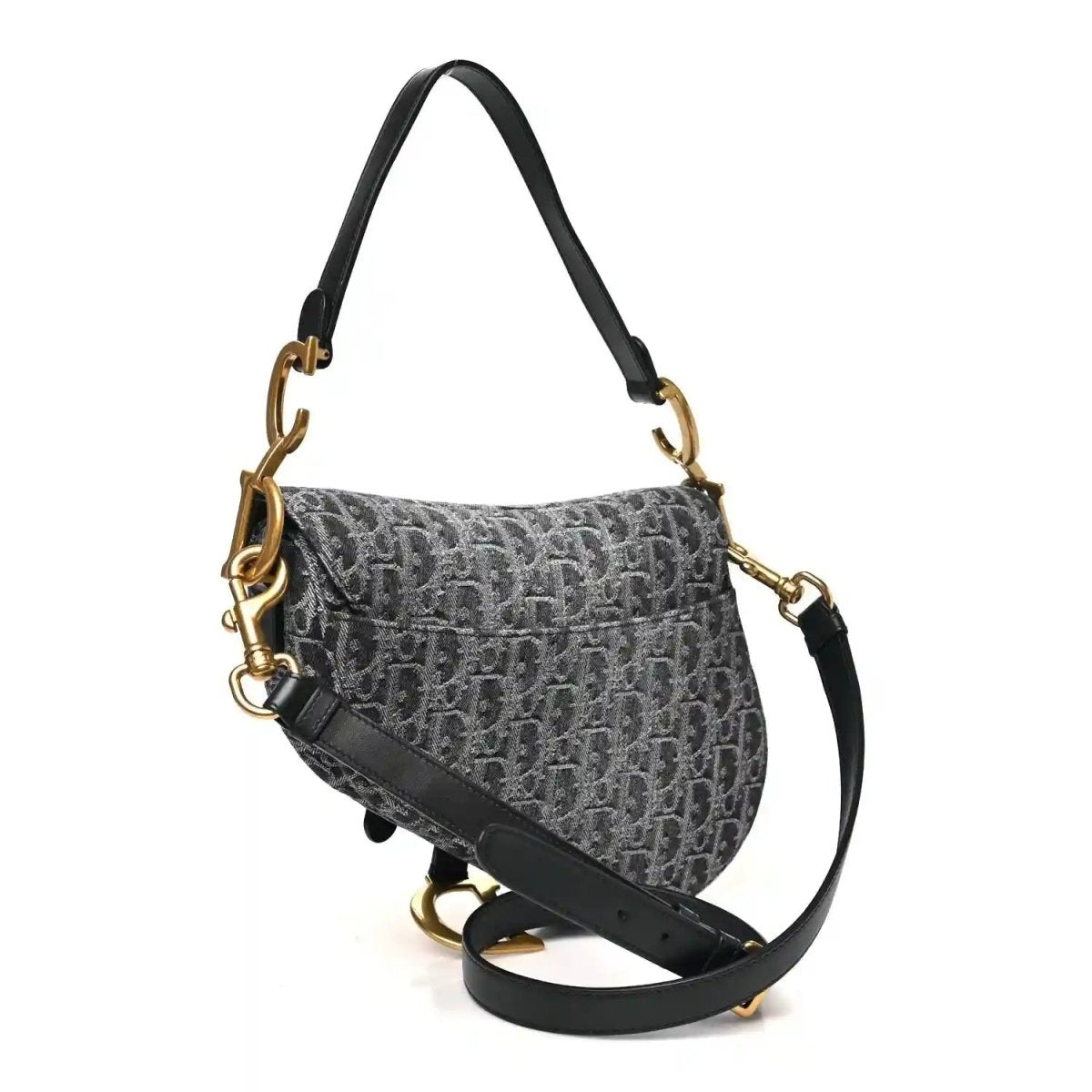 Black jacquard saddle bag with flap, long strap, and gold-tone hardware