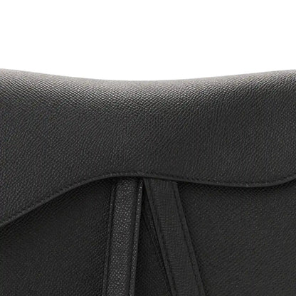 Black grained leather flap with stitched underside and center fold