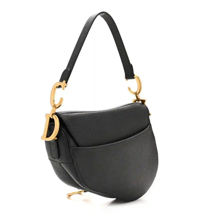Black grained calfskin saddle bag with curved flap and gold-tone D hardware