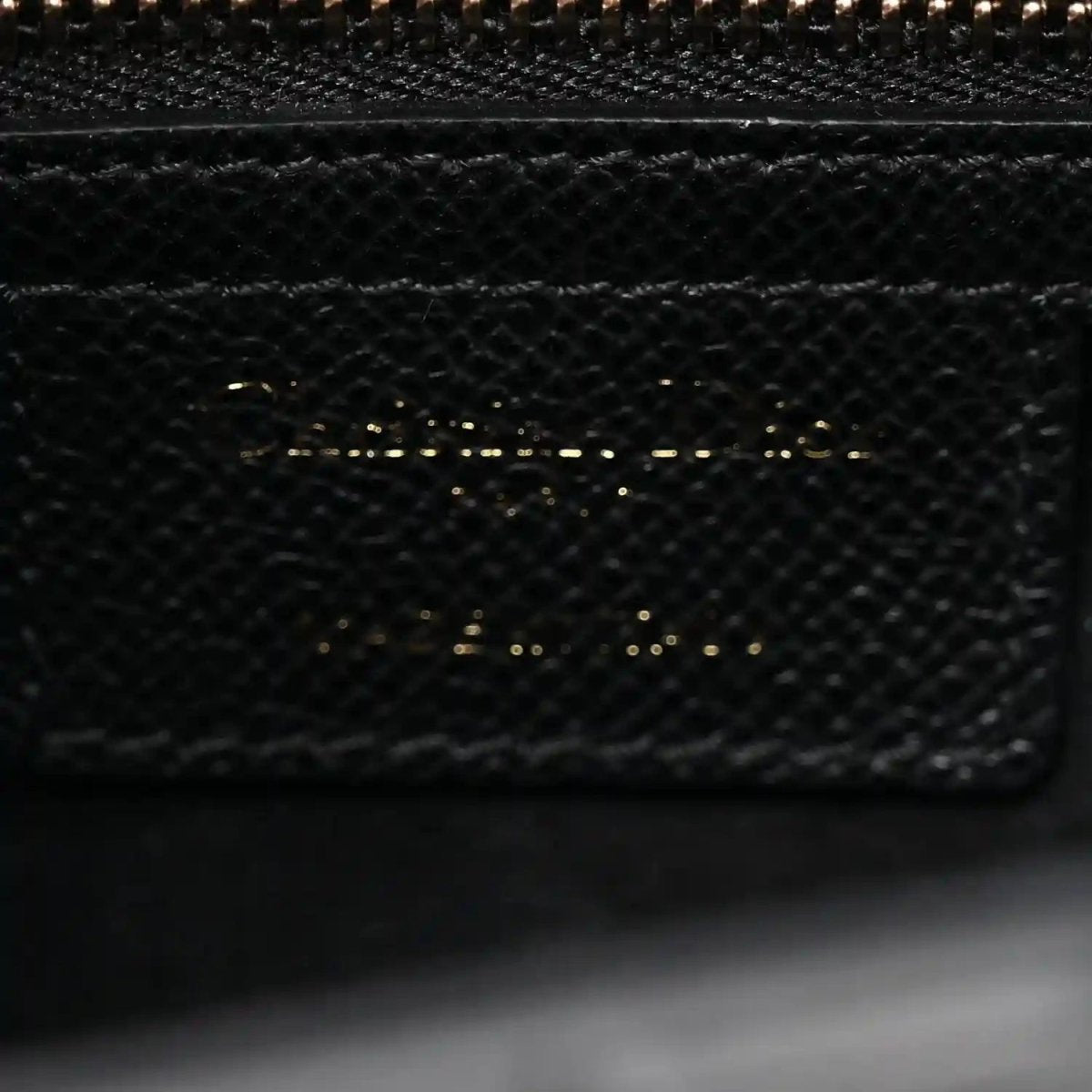 Christian Dior black textured leather bag interior pocket with top zipper teeth