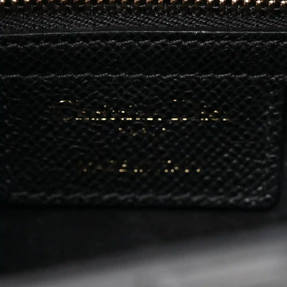Christian Dior black textured leather bag interior pocket with top zipper teeth