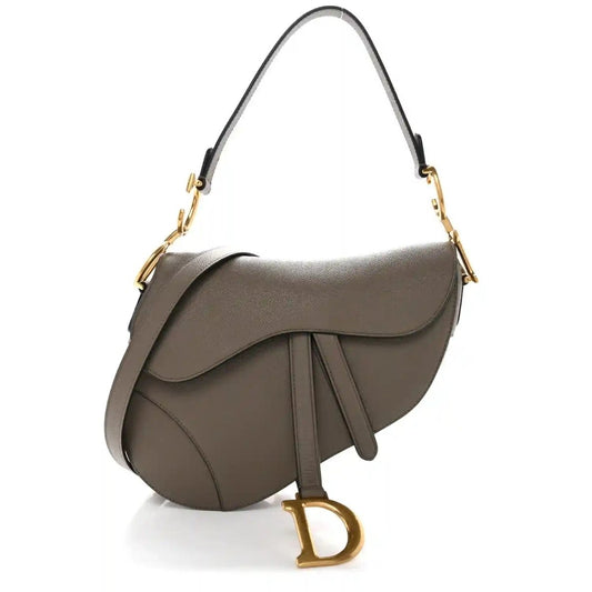 Grained calfskin saddle bag in dark green with flap, gold-tone rings, and strap