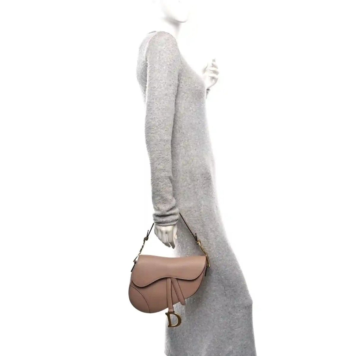 Light pink grained calfskin saddle bag with flap, short strap, and gold-tone D charm