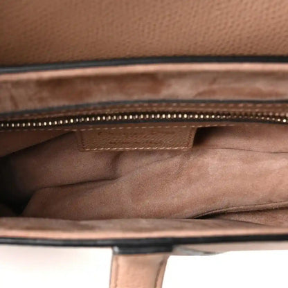 Saddle bag interior view showing stitched lining and zipper track along the top edge