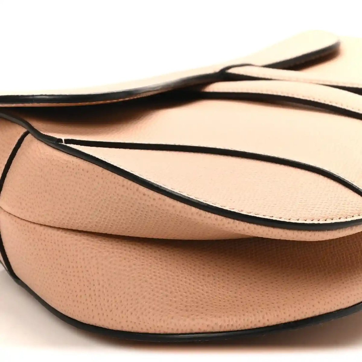 Light pink grained calfskin saddle bag with black-trim shoulder strap and flap