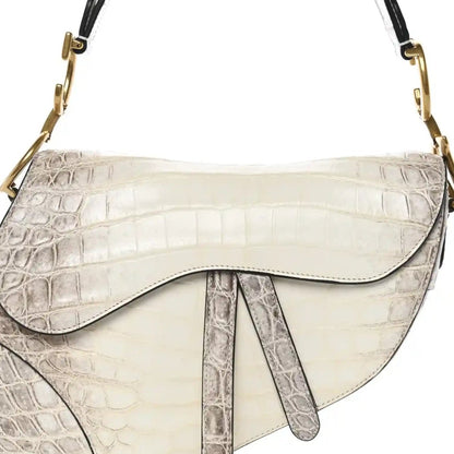 Latte white croc-embossed leather saddle bag with curved flap and gold chain straps