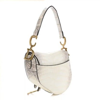 Small white croc-embossed leather saddle bag with gold rings and shoulder strap