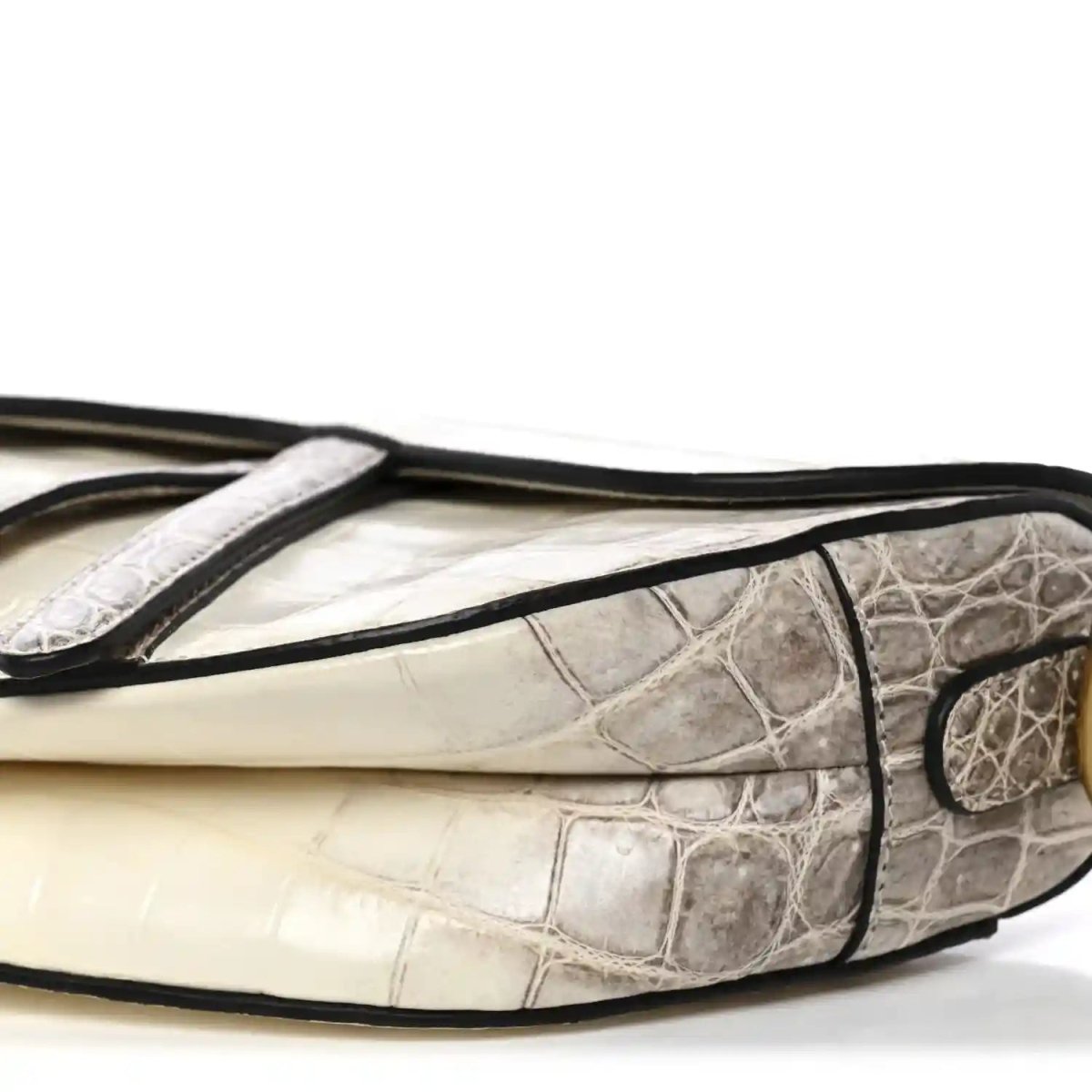 Crocodile-effect leather saddle bag with black handle strap trim