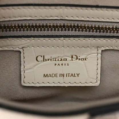 Leather bag interior label reading Christian Dior and MADE IN ITALY
