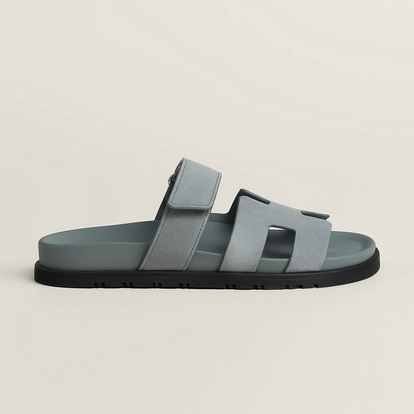 Gray suede slide sandal with three wide straps and black rubber sole