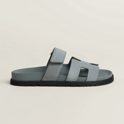 Gray suede slide sandal with three wide straps and black rubber sole