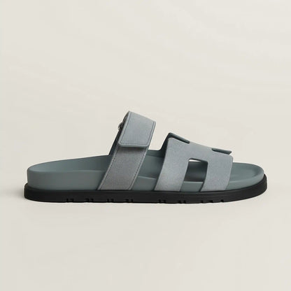 Gray suede slide sandal with three wide straps and black rubber sole