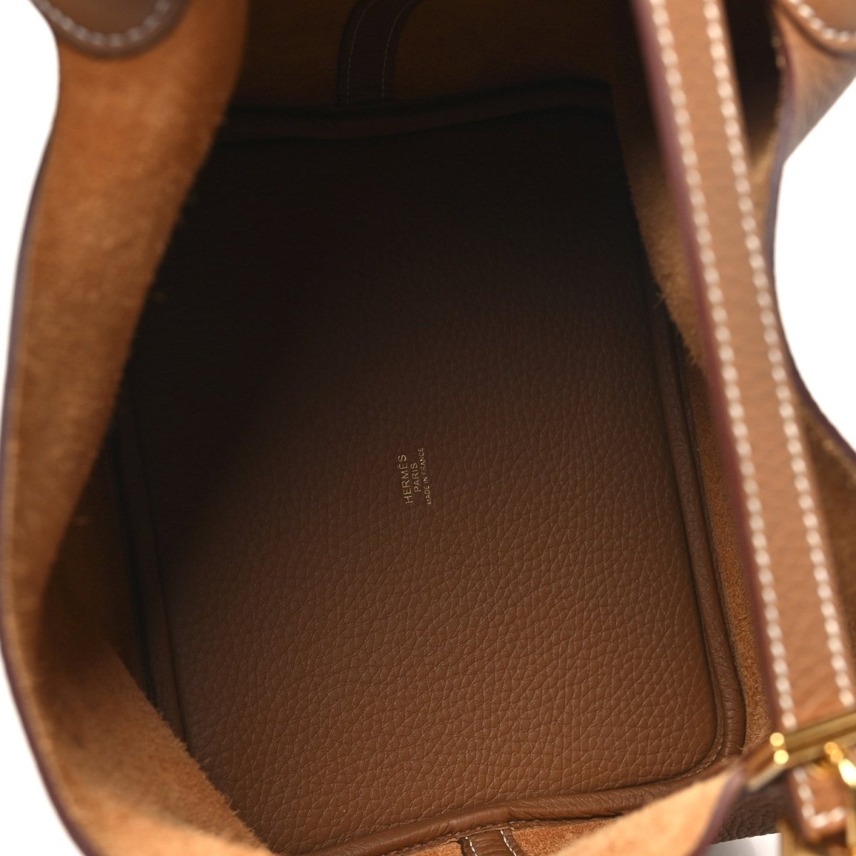 Calfskin leather tote interior lining with embossed logo at the base
