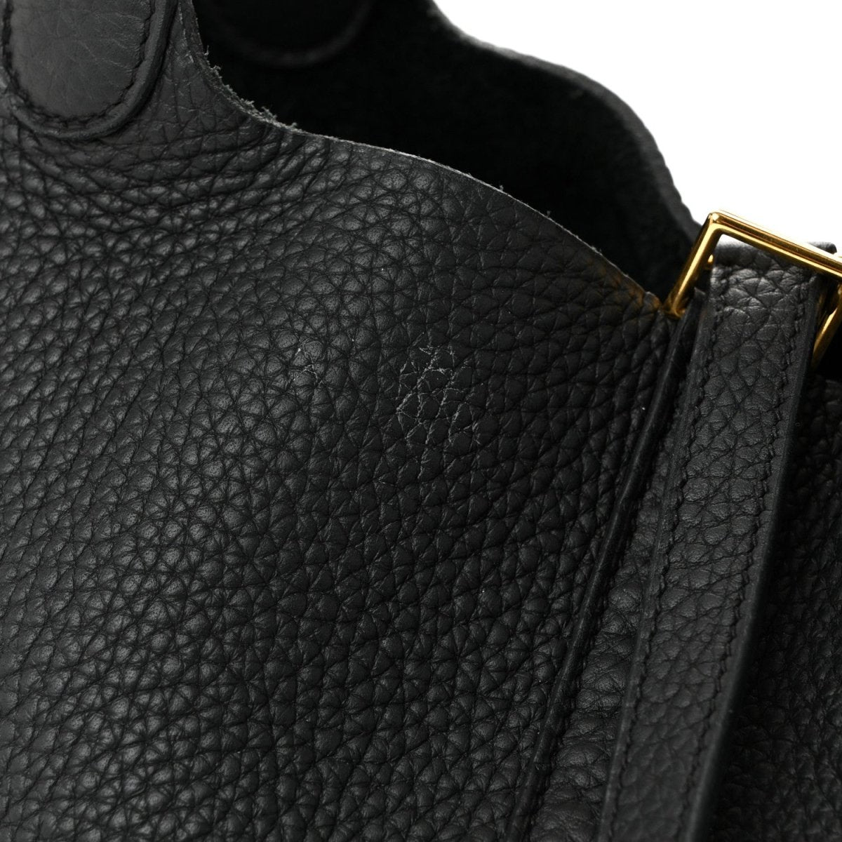 Black pebbled leather tote handbag with gold hardware and top edge seam