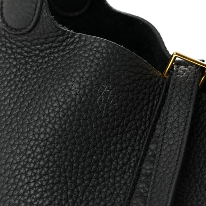 Black pebbled leather tote handbag with gold hardware and top edge seam