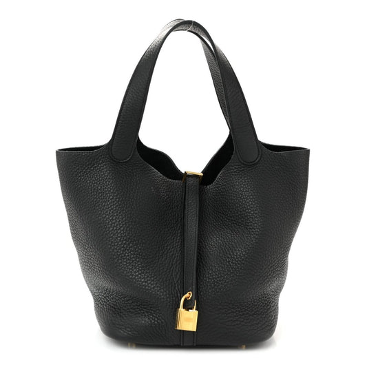 Black pebbled leather tote handbag with gold-tone lock and short handles.