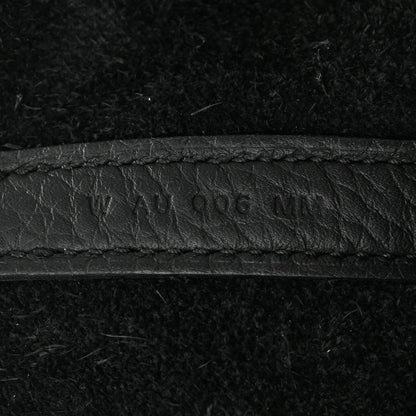 Black leather tote seam with embossed '...406...' marking.