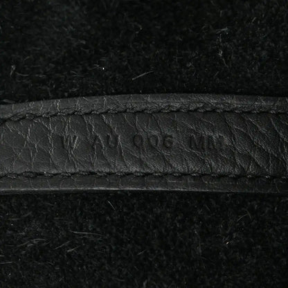 Black leather tote seam with embossed '...406...' marking.