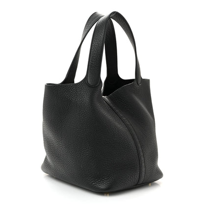 Black pebbled leather tote handbag with short handles and front panel seam.