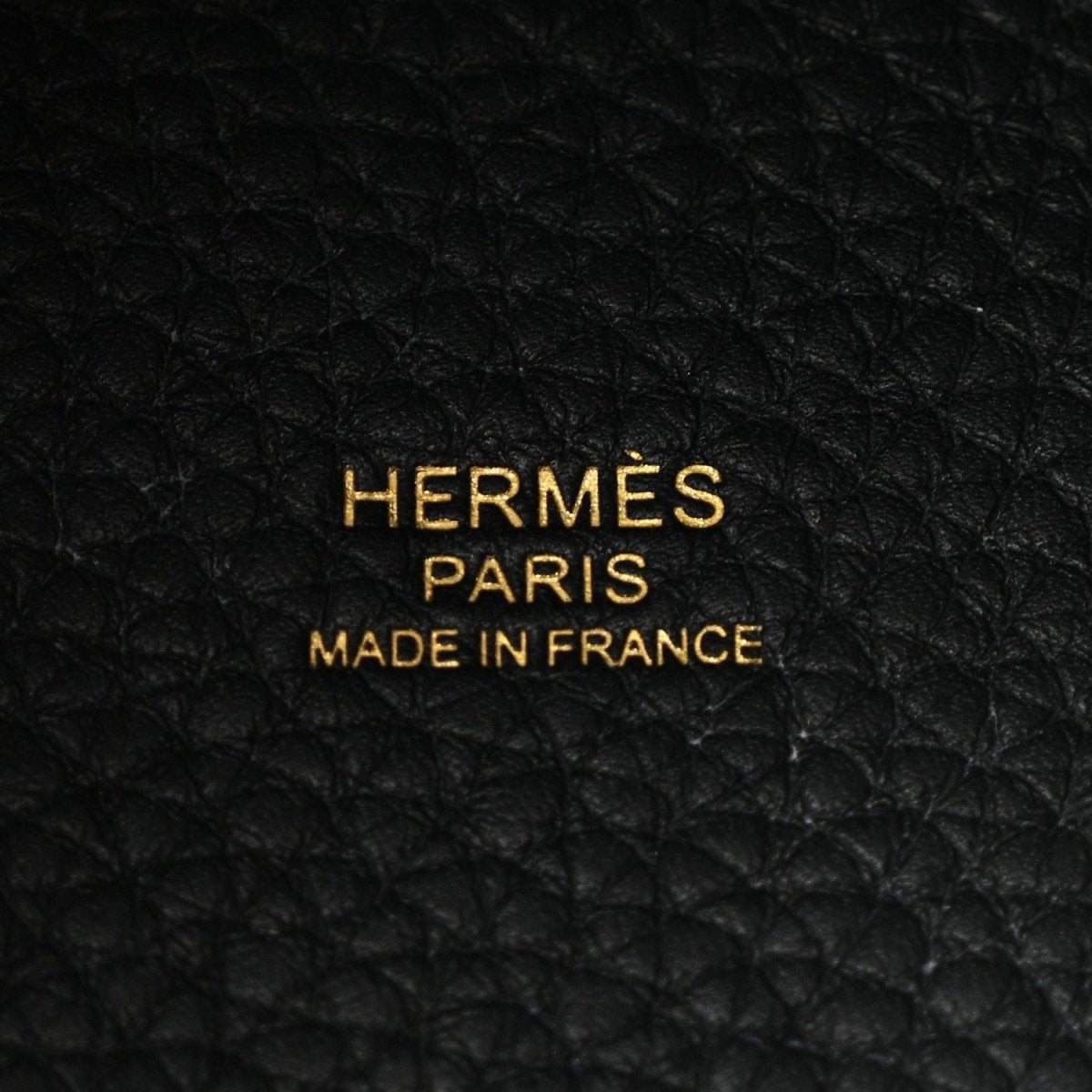 Black leather tote lining with gold 'HERMES PARIS MADE IN FRANCE' lettering.