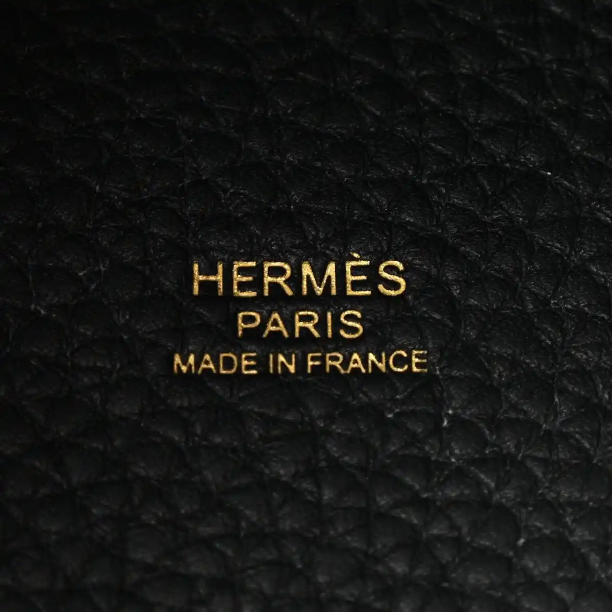 Black leather tote lining with gold 'HERMES PARIS MADE IN FRANCE' lettering.