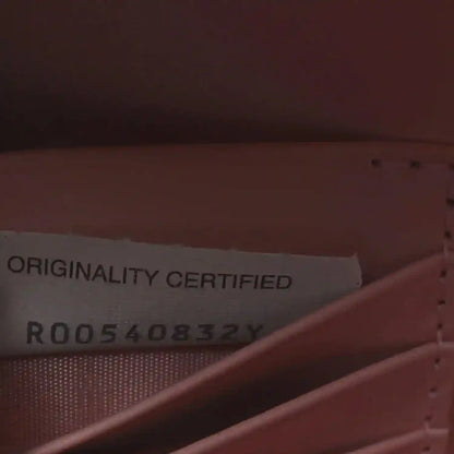 Bottega Veneta clutch authenticity card inside with printed text