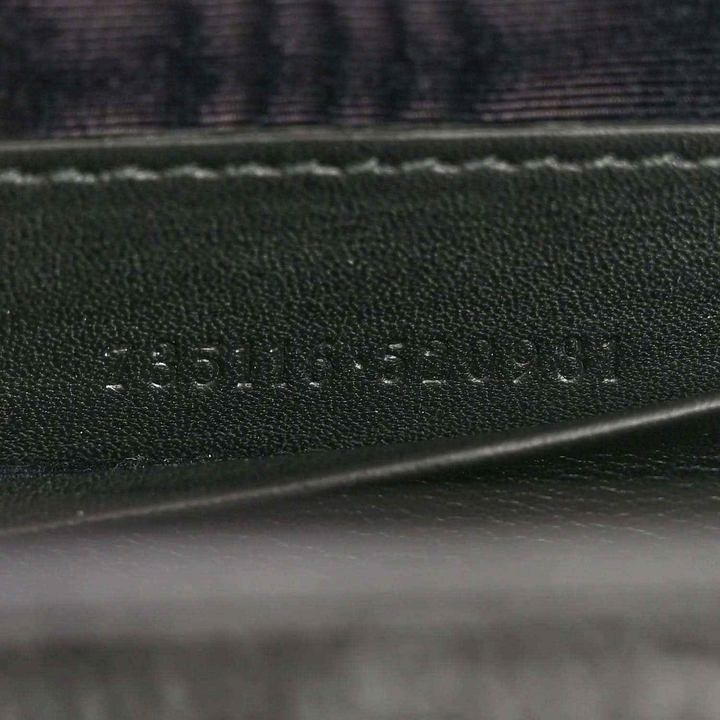 Leather lining with Gucci logo emboss and visible stitching detail