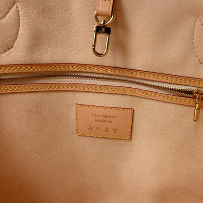 Beige interior pocket with Louis Vuitton label and gold-tone zipper hardware