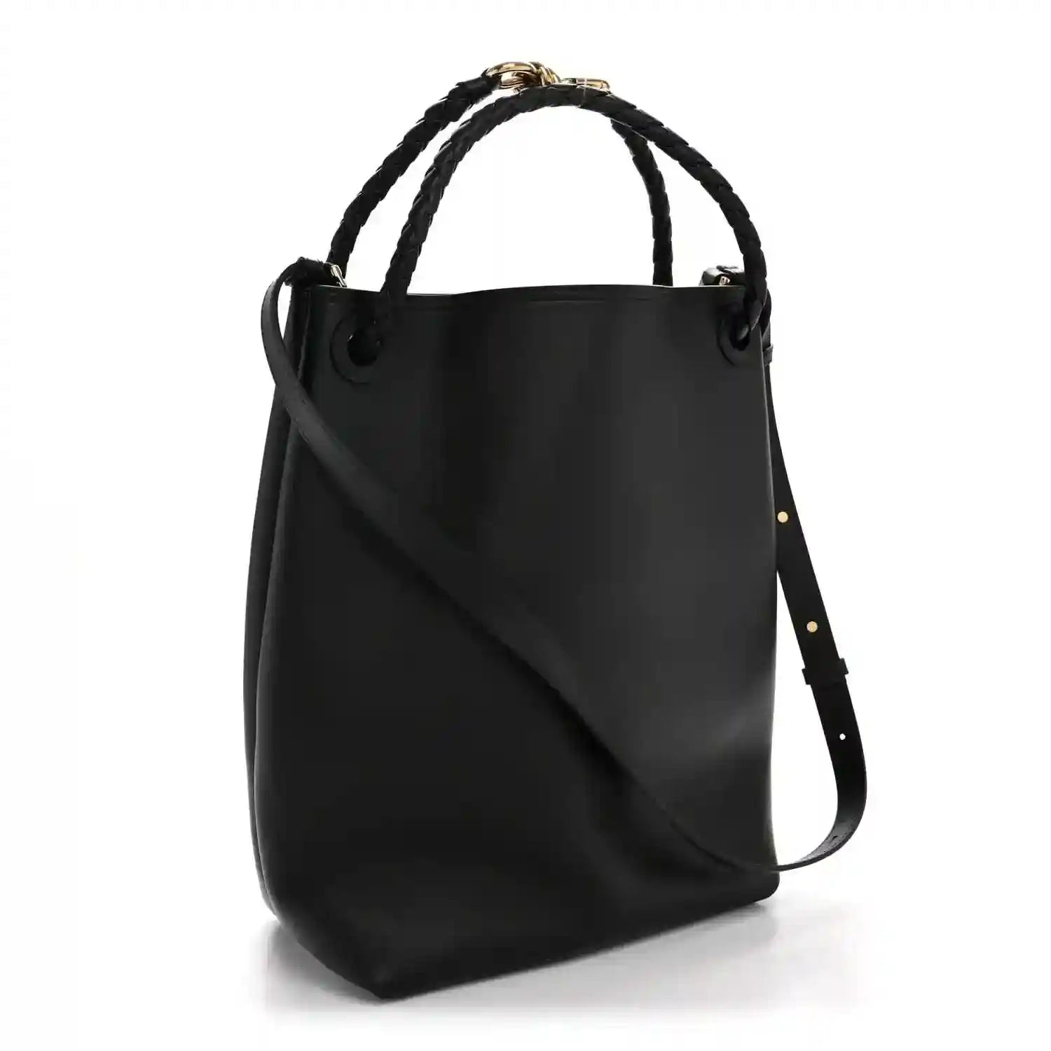Black bucket bag in silky calfskin with braided handles and crossbody strap