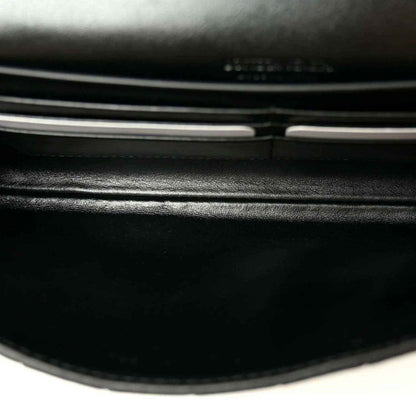 Black leather clutch clasp bar and hinge detail