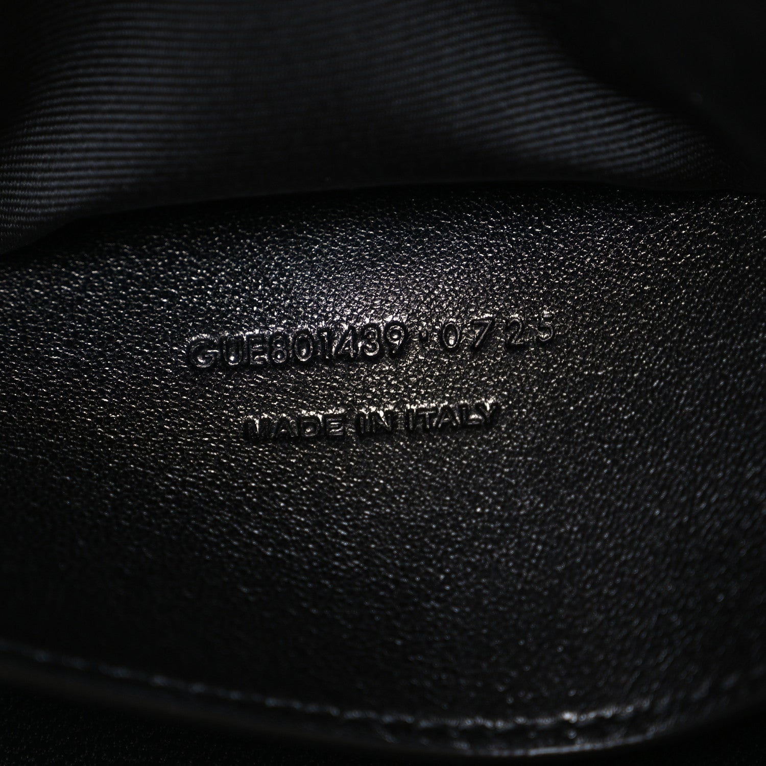 Black leather stamp with product code and "MADE IN ITALY" text